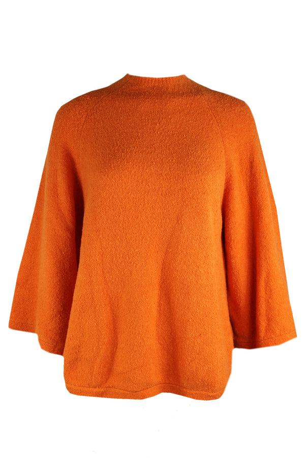 Caroline Biss oranje trui.