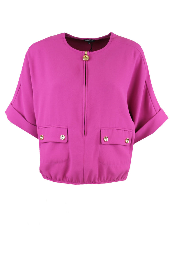 Caroline Biss blouse met een goudkleurige rits aan de voorkant.